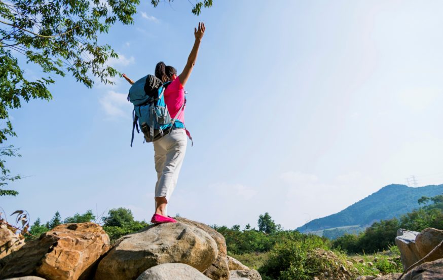 Female traveller on mountain top