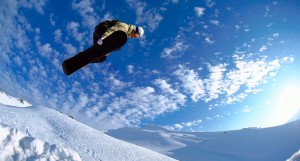 Man performing a snowboard jump